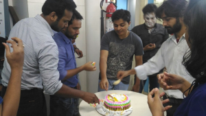 people cutting cake